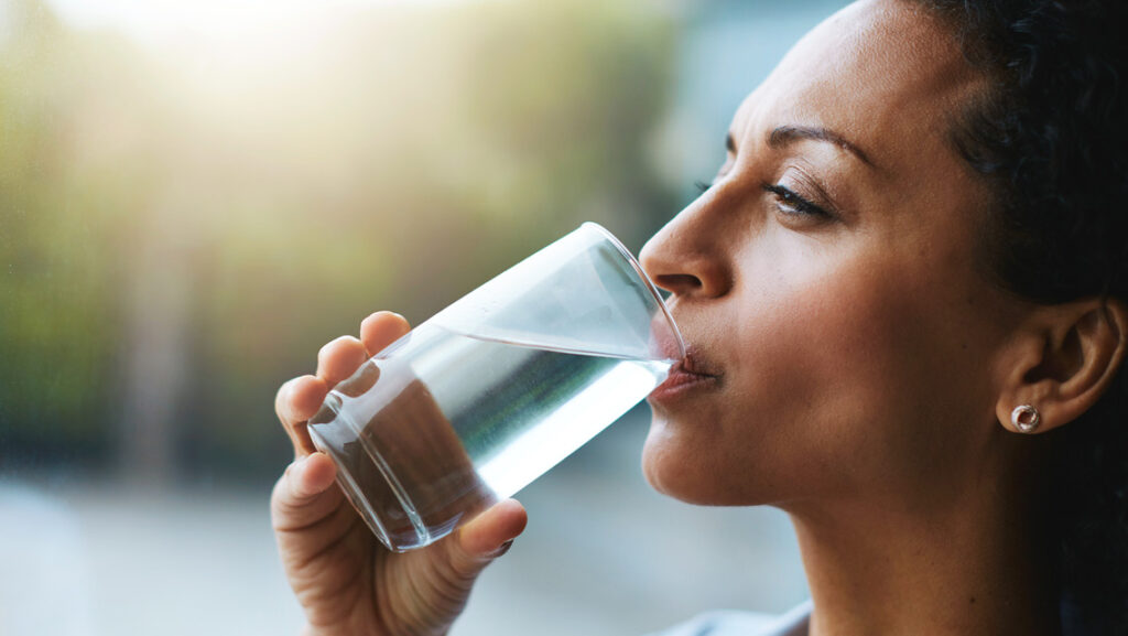 Woman drinking water that is high in nitrates