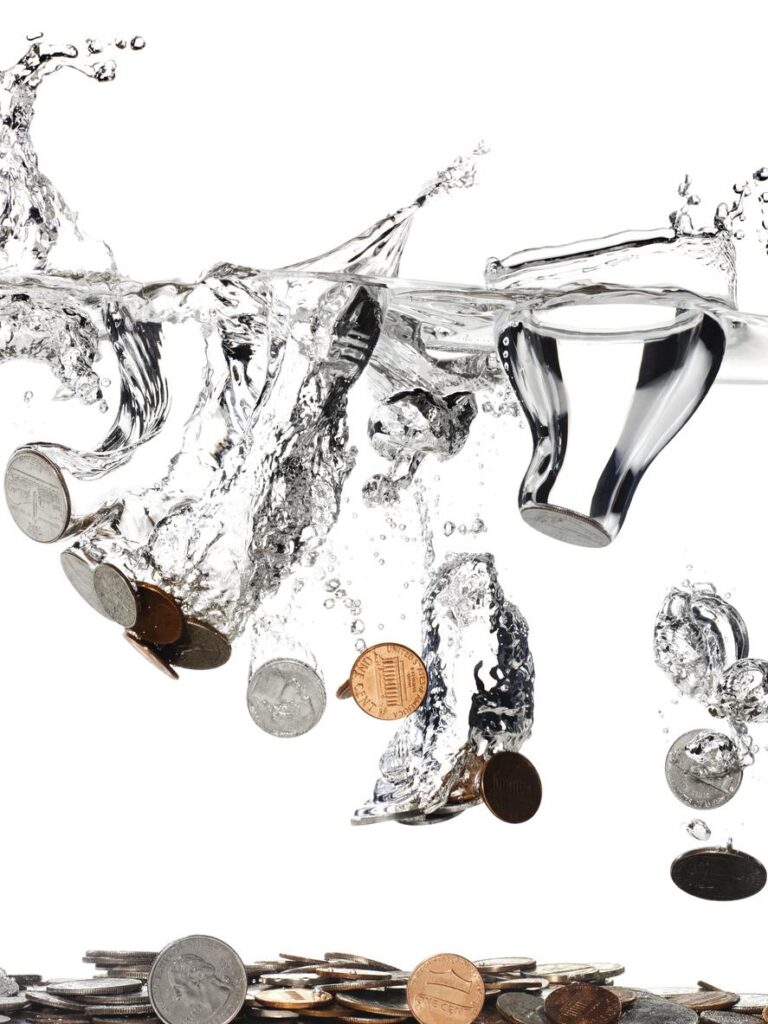 Coins falling into water, representing metal-tasting water.
